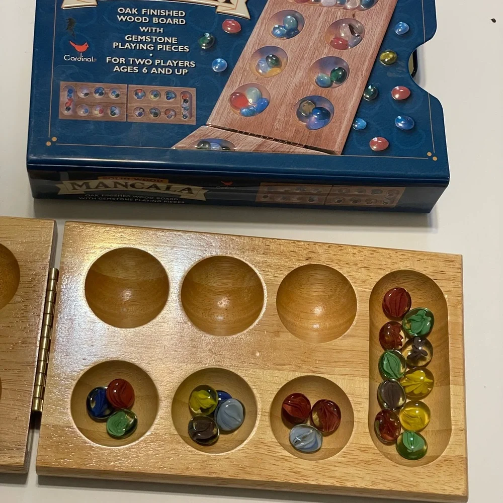 Folding Wooden Mancala Game with Colorful Stones In Metal Box